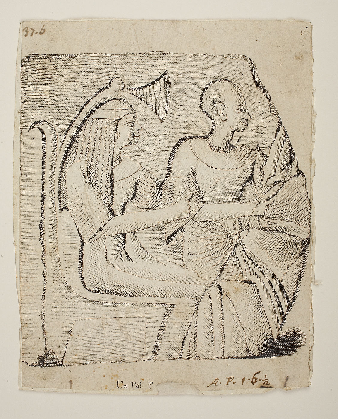 To siddende ægyptiske figurer