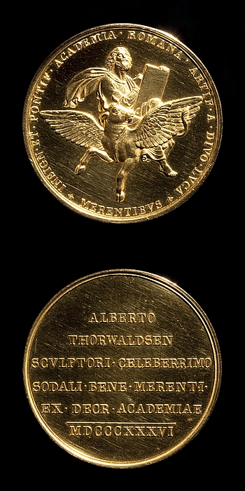 Medalje forside: Lukas. Medalje bagside: Indskrift