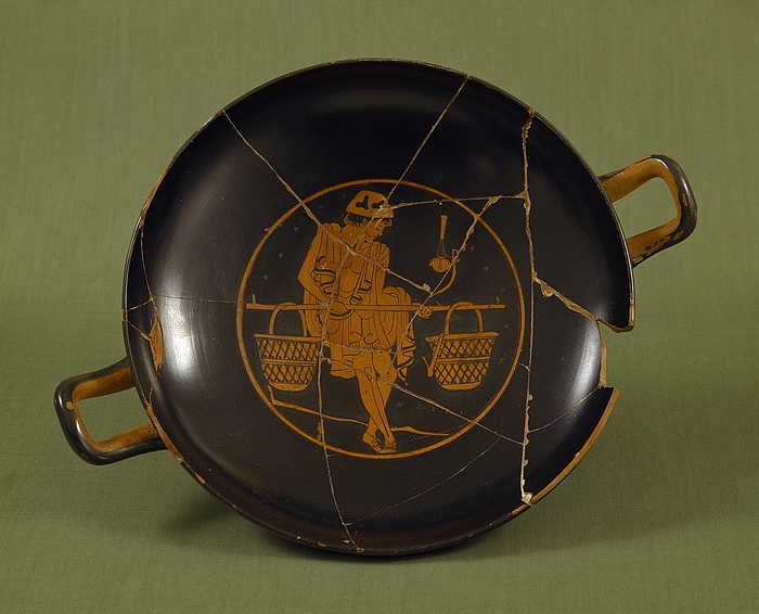 Kylix med en ung mand med åg. Græsk