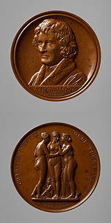Medalje forside: Portræt af Thorvaldsen. Medalje bagside: Gratierne og Amor